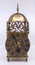 A 19th century brass lantern clock with double fusee, probably German.  Made in the English style of