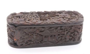 A Chinese carved tortoiseshell snuff box, carved with figures in pagoda and buildings, with trees