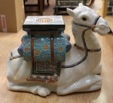 A ceramic garden seat in the form of a camel