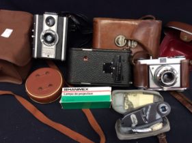 Collection of Kodak vintage, Mid 20th C Cameras in cases and accessories.