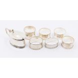 A collection of silver to include; a George V oval mustard pot, hinged cover and four ball feet,