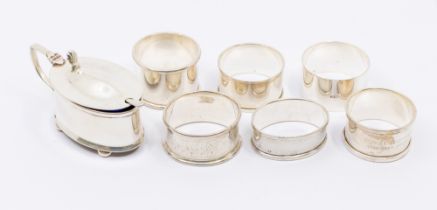 A collection of silver to include; a George V oval mustard pot, hinged cover and four ball feet,