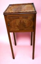 A George III walnut and mahogany single door pot cupboard/night stand on long tapered legs.