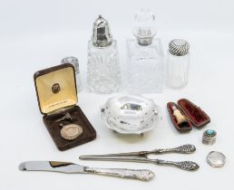 A collection of silver items to include; a modern fluted edged silver three footed dish,