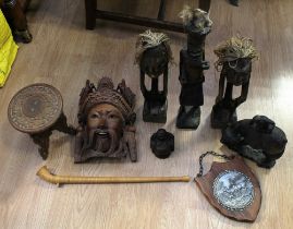 A mixed lot of wooden and treen items to include; an early 20th century Chinese carved wooden figure