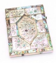 A mother of pearl and abalone shell floral designed card case, having hinged cover. Further Details: