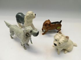 Four boxed Beswick dogs, Norfolk Terrier, Old English Sheepdog, West Highland and English Setter.