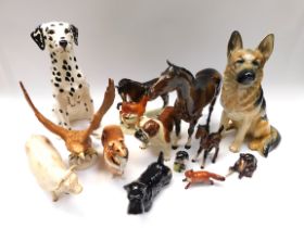 A collection of various Beswick animal figurines to include; a large Alsatian, a large Dalmation,
