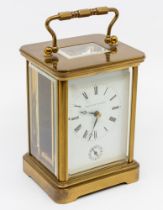 A Matthew Norman of London, brass cased carriage clock, with handle to top and eleven jewels