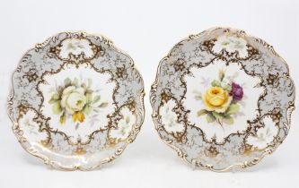 Coalport - Two hand painted floral decorated plates, fluted edged, signed by F. Howard. (2)