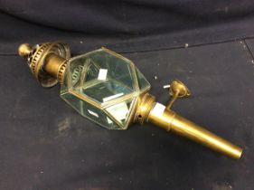 Vintage brass carriage lantern converted to porch light.