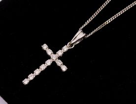A diamond set 18ct white gold cross, comprising grain set round brilliant cut diamonds, total
