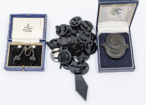 A collection of 19th century jet type jewellery to include a pair of drop earrings modeled as