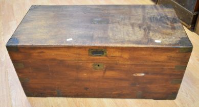 A 19th century mahogany travel chest in the campaign style with cast carry handles and brass