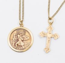 A 9ct gold St Christopher, width approx 22mm, suspended on a fine 9ct gold trace link chain,