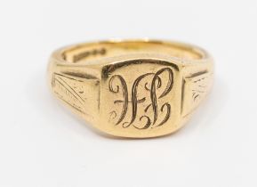 A gentleman's 9ct gold signet ring, square initialed top J.H, width approx 12mm, engraved raised