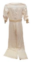 A late 1960s / early 1970s 'Paul Nichols & Co. London' jumpsuit in a cream woven (in a square