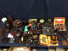 A collection of Bakelite items: mixed colours, items to include tazza, flasks, boxes, a clock, a