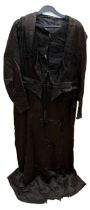 A black Edwardian dress 1908/10 in silk sateen, the bodice is decorated with couched braiding and