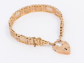 A 9ct rose gold gate bracelet with heart padlock width approx 10mm, length approx 18cm, weight