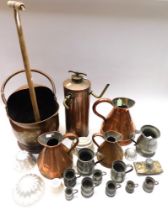 Collection of copper, brass and pewter wares, to include measures, jugs, coal scuttle, fire