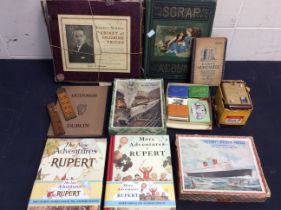 A collection of mixed childs games, books and other collectors items to include; Rupert facsimile