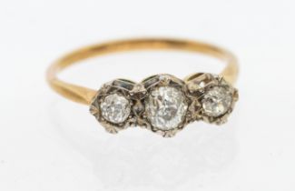 A three stone diamond and 18ct gold, comprising a three illusion set graduated old cut diamonds,