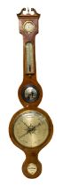 A late 19th/early 20th century veneered oak barometer, with mirrored centre.