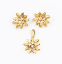 A pair of diamond and 18ct earrings, in the form of a flower set to the centre with three small