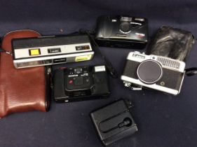 Collection of late 20th century cased cameras.