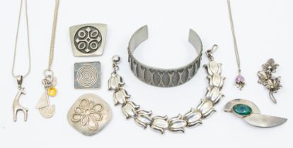 A collection of jewellery including an ILaria silver bracelet, comprising blue bell motif links,