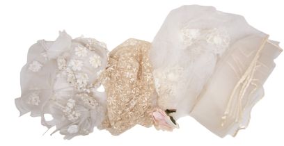 A small collection of bridal wear to include: a medium-length tulle veil edged in fine satin,