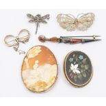 A collection of various brooches to include a 19th century large cameo brooch, depicting a seated
