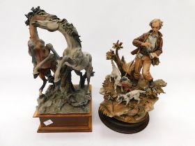 Two Capo De Monte figures on wooden stands of two wild horses and pheasant hunter.