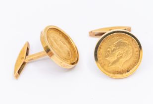 A pair of 9ct gold cufflinks inset with George V half sovereigns, swivel fittings, total gross