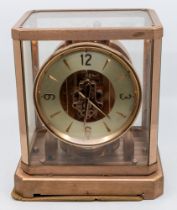 Mid 20th century atmospheric mantle clock in glazed case.