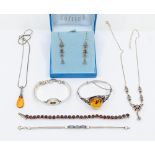 A collection of silver and stone set jewellery to include an amber bangle, comprising an oval