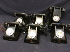 A collection of 6 vintage telephones, all in black, including GPO and a wall mounted example.