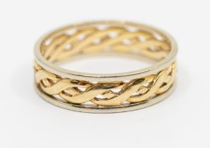 A two tone 9ct gold Celtic band, comprising a gold woven Celtic centre within a border of white