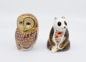 Two boxed Royal Crown Derby gold stopper paperweights, owl and panda.