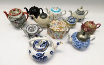 A collection of 19th century and early 20th century porcelain and china teapots, including Copeland,