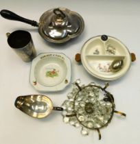 A collection of children's dishes and plate warmer along with a ceiling light and plated items.