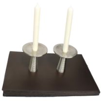 A pair of modern David Mellor Sheffield stainless steel candle holders, of ribbed modernist design