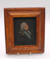 An early to mid 19th century walnut framed wax relief silhouette portrait, possibly The Duke of