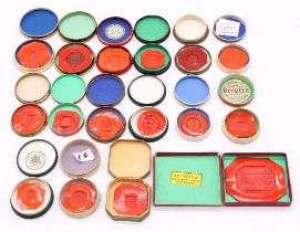 A collection of eighteen 19th Century red wax seal examples in paper boxes and covers