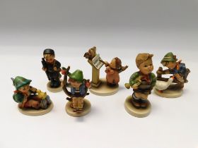 Goebel/MJ Hummel - A collection of six figurines to include "Singing Lesson" and others (no