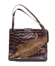 A dark brown crocodile handbag from the late 1930s/40s, flap fastening, metal zip, baby crocodile
