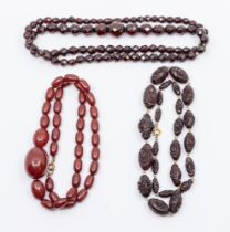 A collection of three Cherry Bakelite/plastic type bead necklace, comprising one graduated oval bead