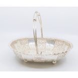 A late Victorian silver oval shaped centre basket/bowl, fluted edge with elaborate floral and