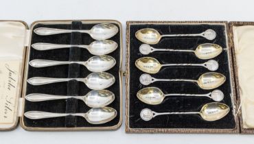 A set of six George V silver novelty teaspoons, gilt bowl with partial twist handle, each terminal